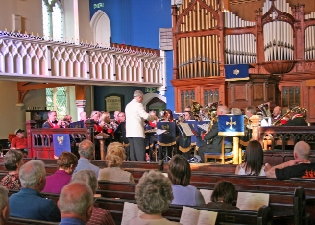 Phoenix Brass band performing to support Christian Aid