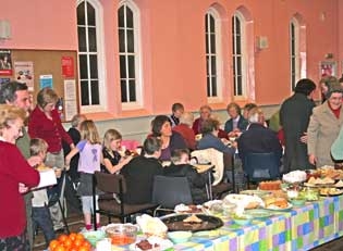 pictures shows a buffet meal in church hall